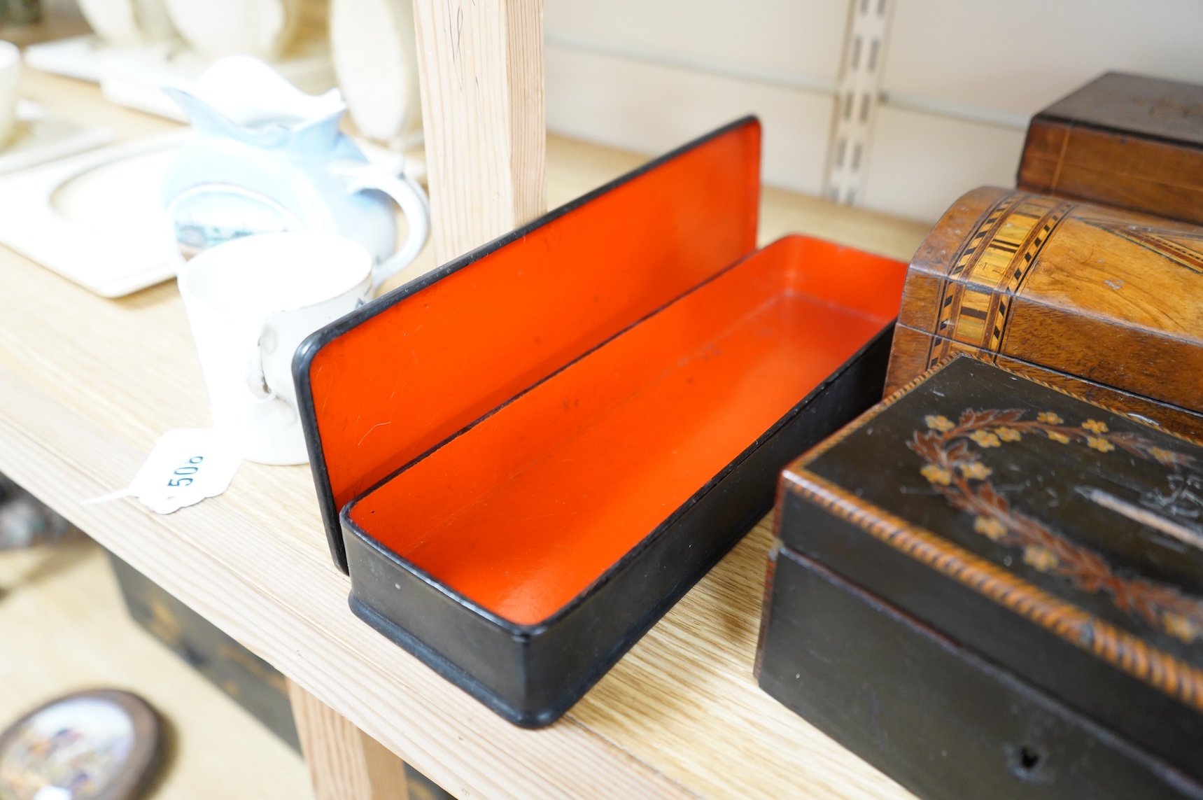 A blonde tortoiseshell veneered box, six other boxes and a miniature bagatelle board